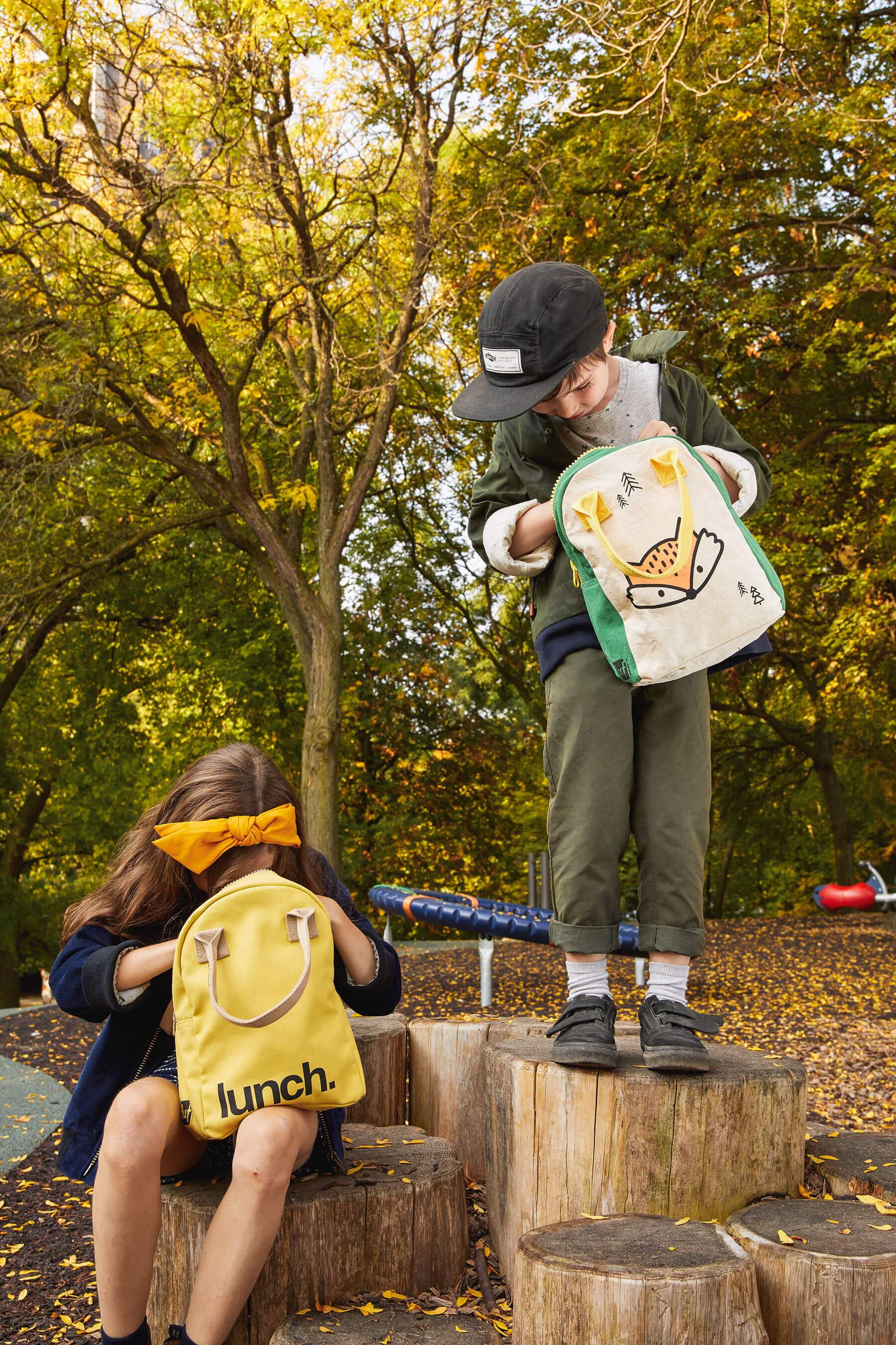 kids opening the Fox Lunch Bag and yellow 'lunch' bag
