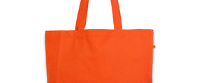 Orange Classic tote bag with Groceries Etc. text in burgundy