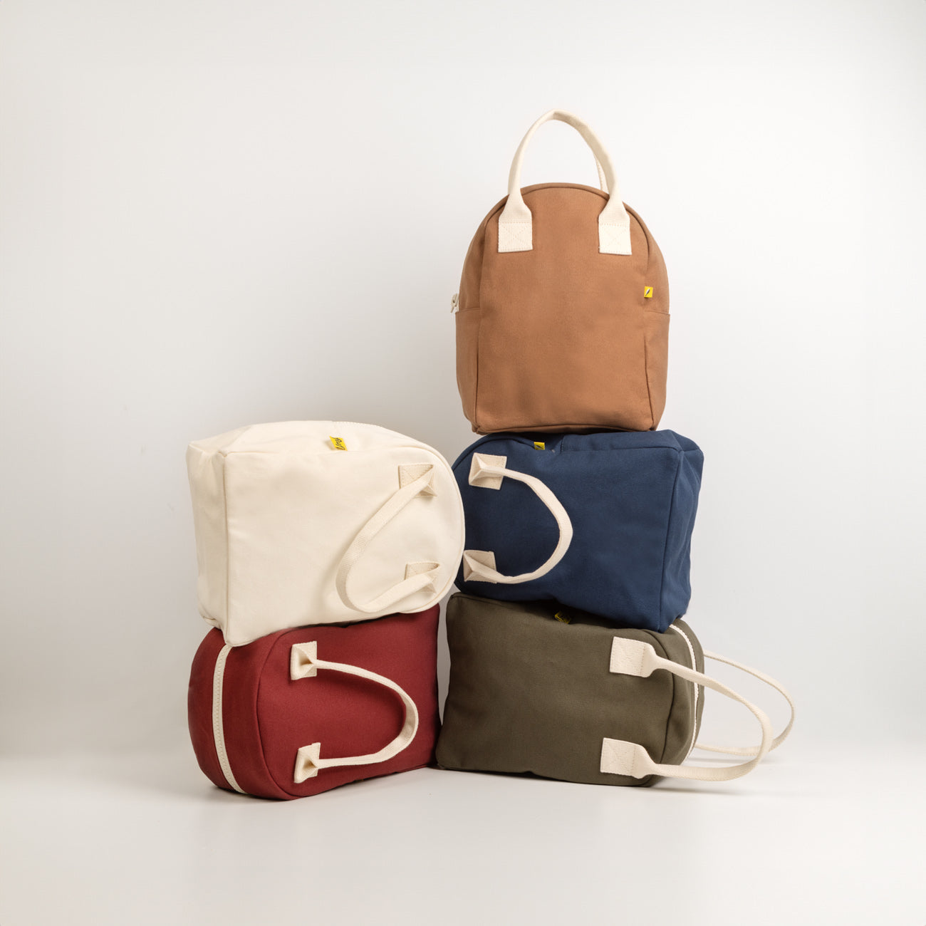 Collection of Fluf zipper lunch bags: green, white, red, nutmeg and blue lunch bags