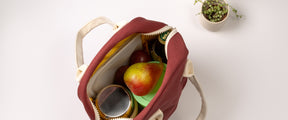 Burgundy zipper lunch bag with pear to demonstrate the safe food feature